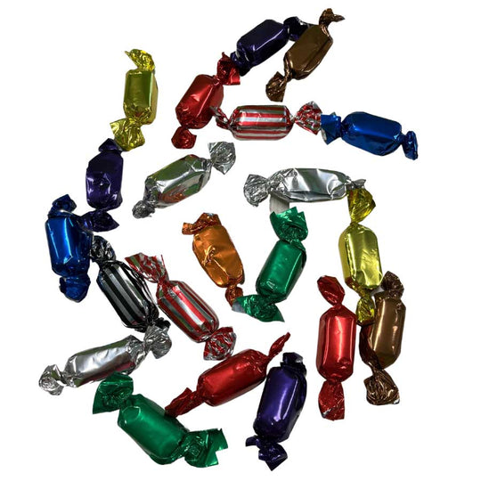 Assorted colorful wrapped candies on a white background