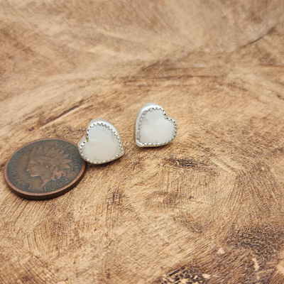 Mother of Pearl Heart Stud Earrings Sterling Silver on Wood by coin for Comparison