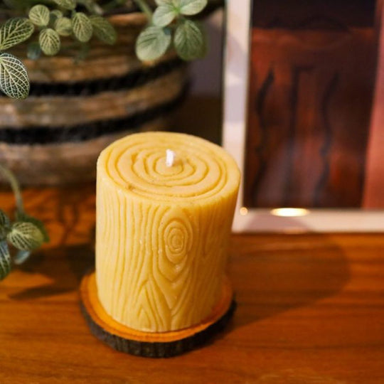 Lit Bees Wax Candle On A Coffee Table 