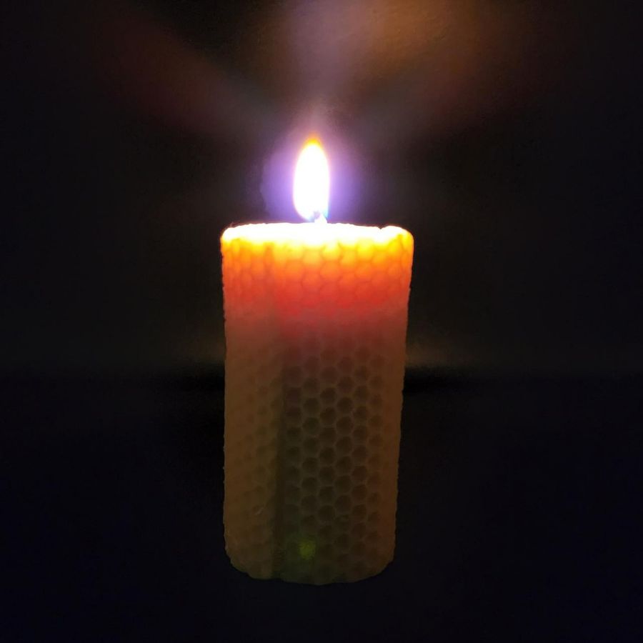 A Lit Bees Wax Candle 