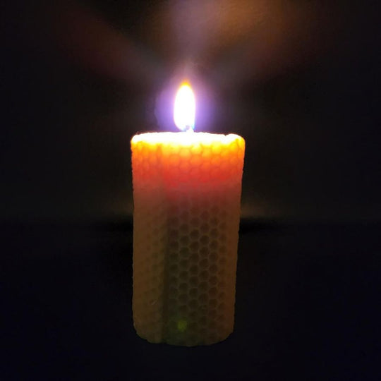 A Lit Bees Wax Candle 