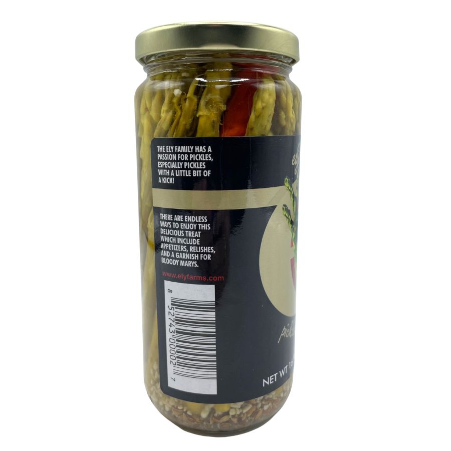 The side of a jar of pickled asparagus