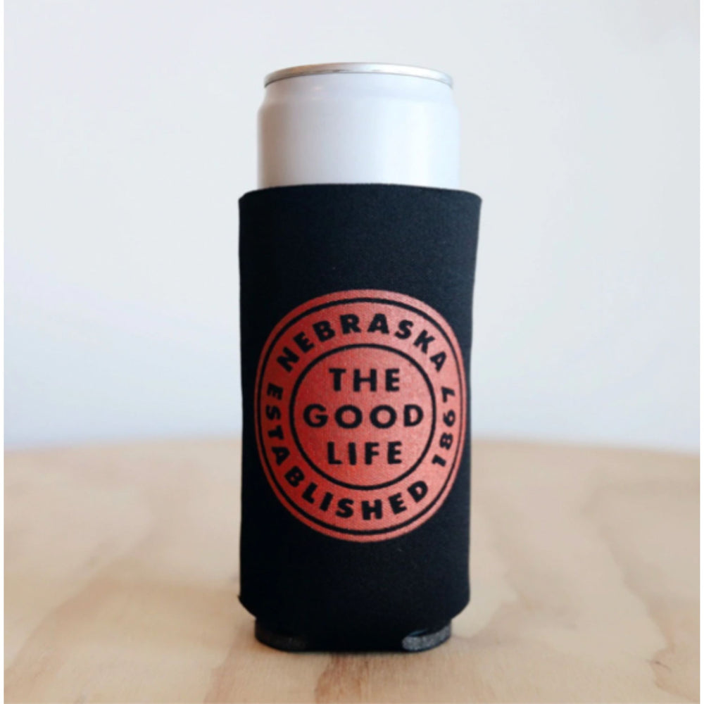 A black can koozie with red and white text that reads 'Nebraska The Good Life Est. 1867'.