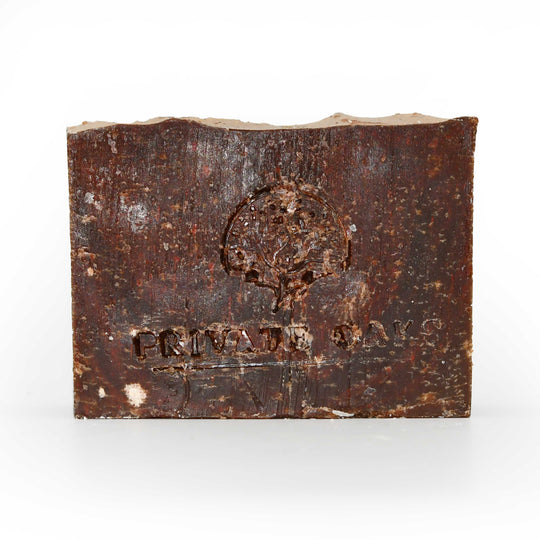 Rustic soap with a logo and text on a white background