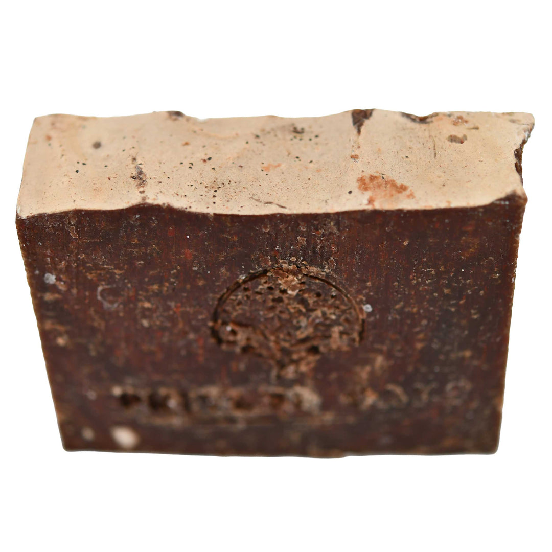 Bar of soap with a visible brand logo on a white background