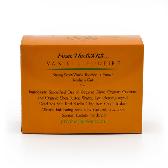 Bar of soap with 'Vanilla Bonfire' scent on an orange packaging against a white background