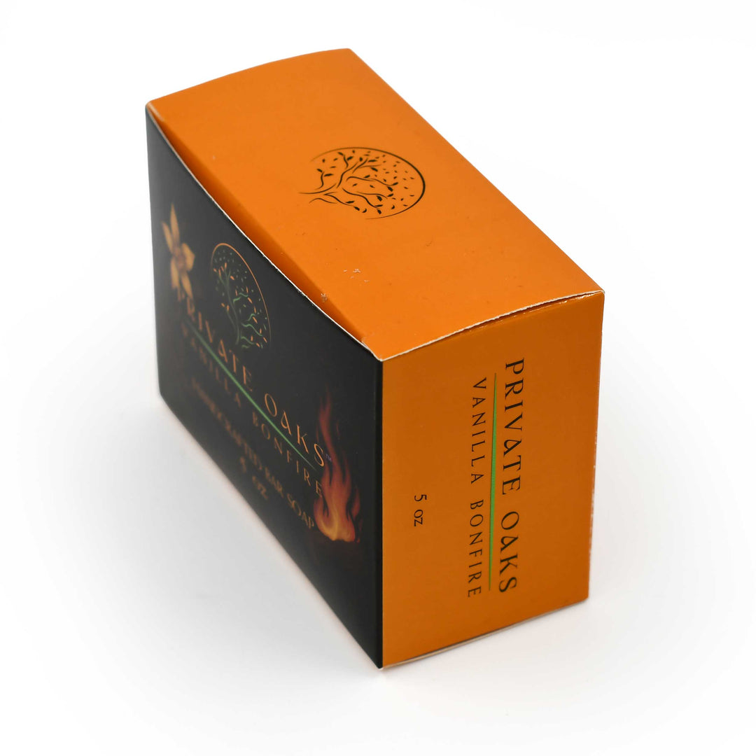 Orange and black packaging of Private Oaks Vanilla Bonfire on a white background