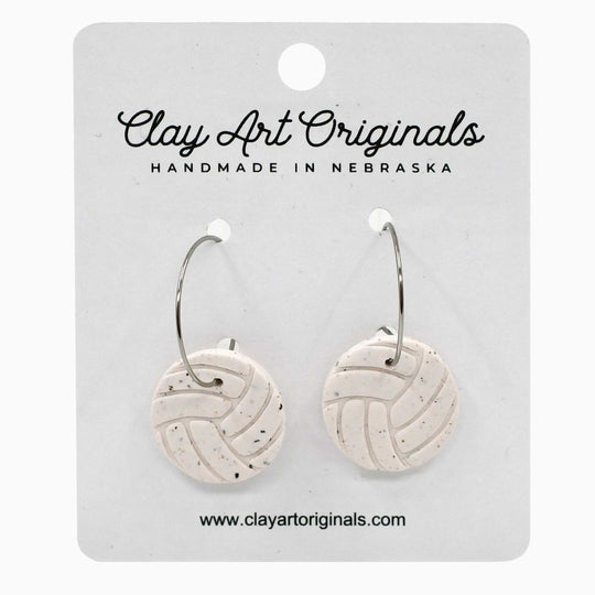 Pair of round earrings on a 'Clay Art Originals' card.