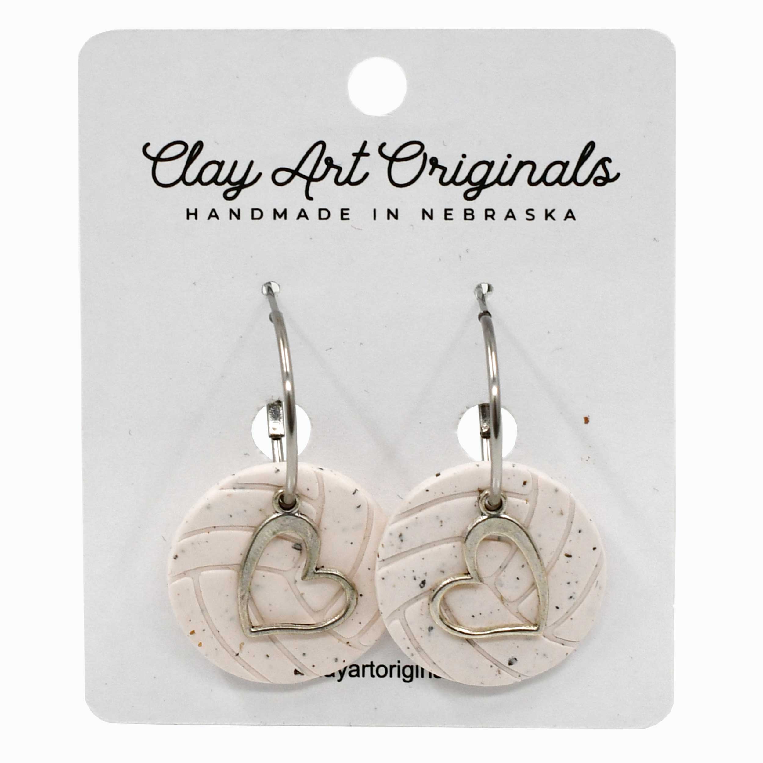 Heart-shaped earrings on a Clay Art Originals branded card