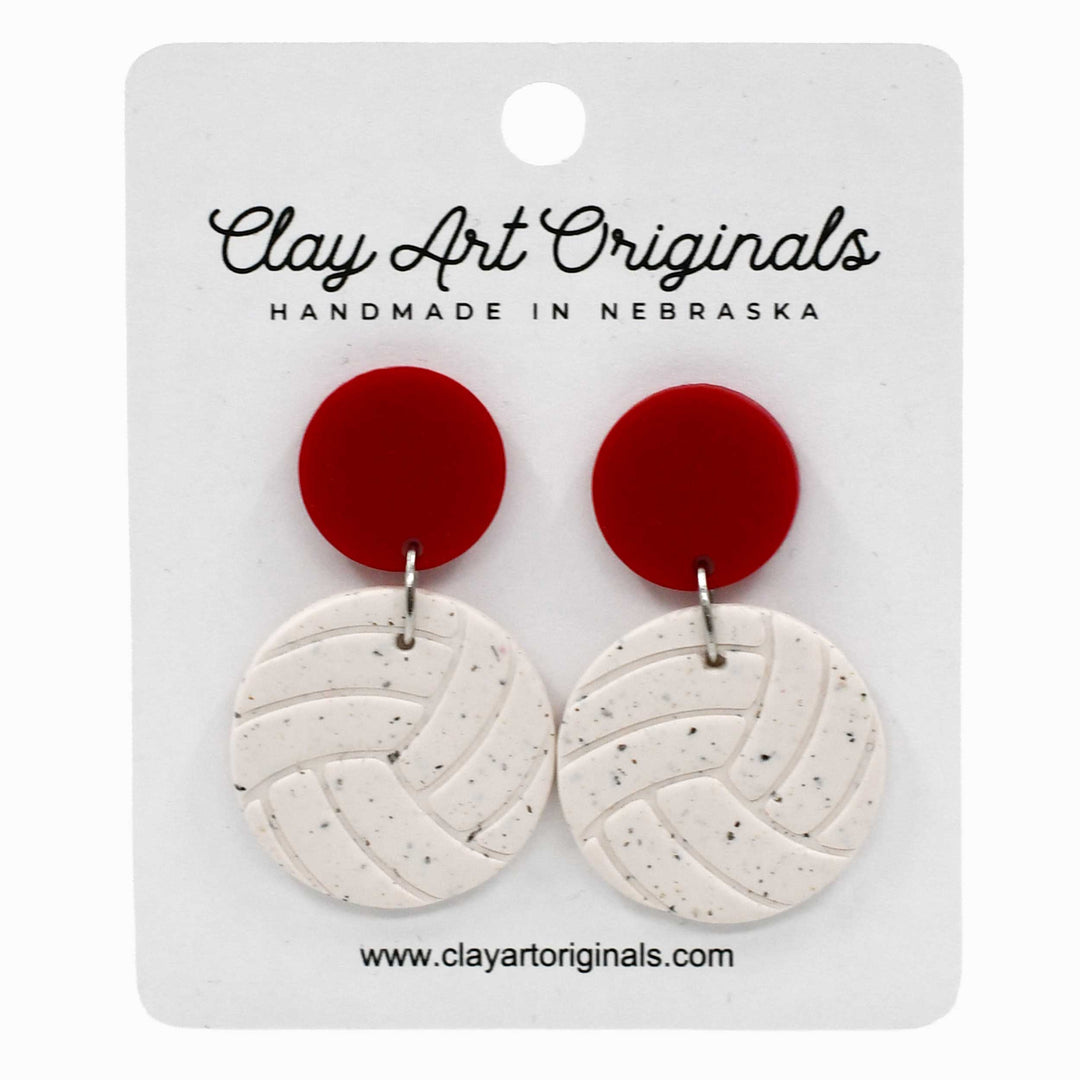 Red and white earrings on a Clay Art Originals card