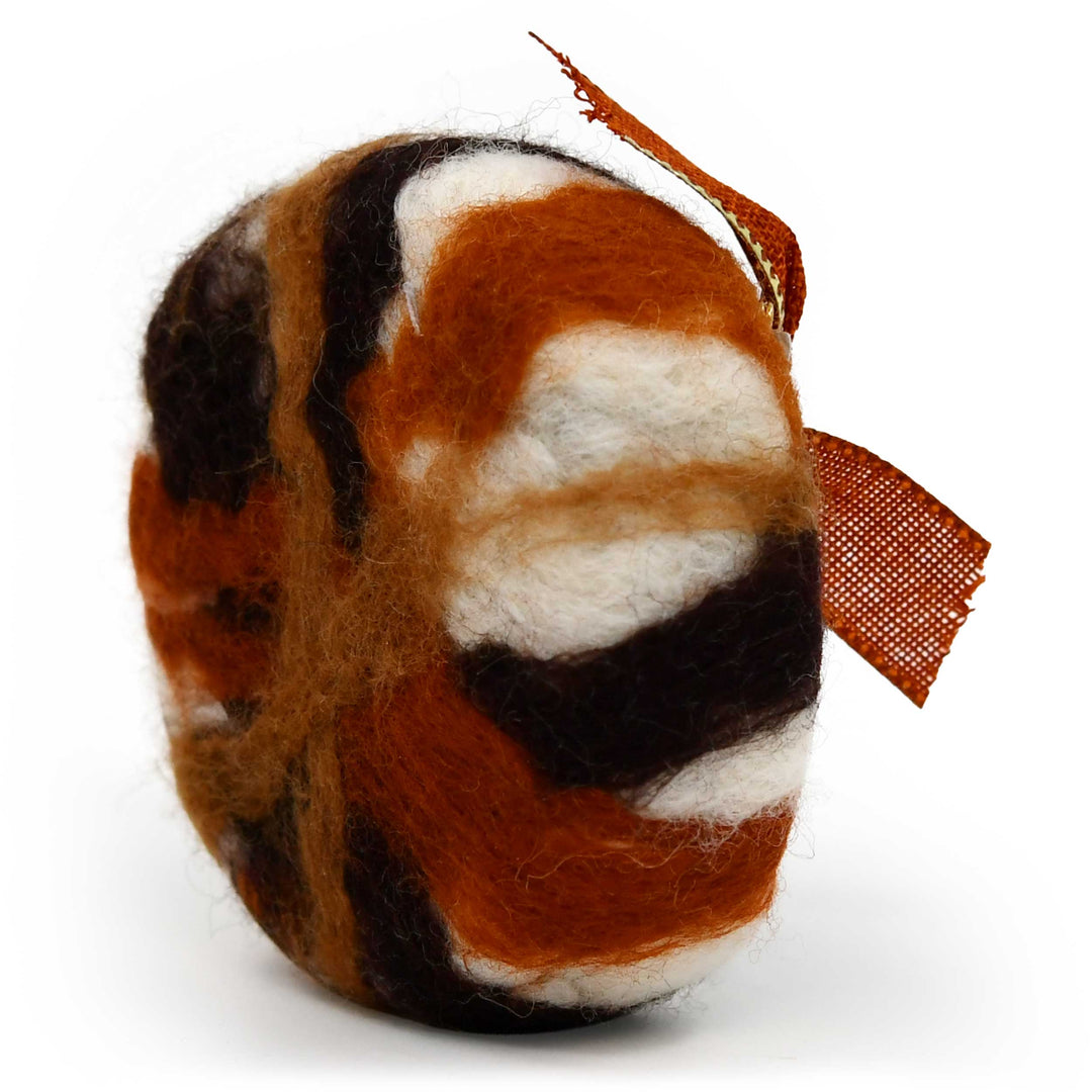 Felted soap with brown, black, and white pattern on a white background