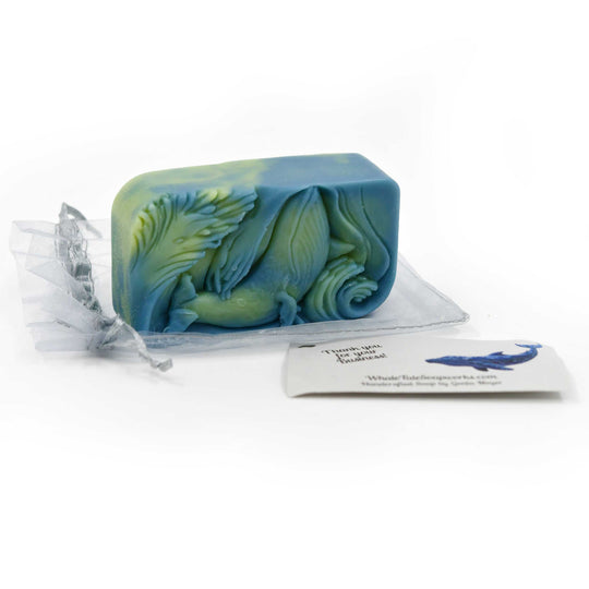 Blue and green soap bar with a decorative design on a white background