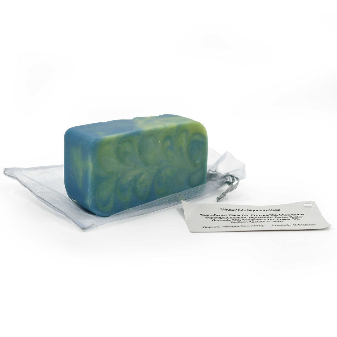 Green and blue soap bar on a white background with a label next to it.