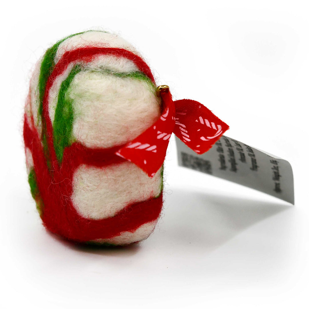 Red, green, and white felted soap with a red bow on a white background