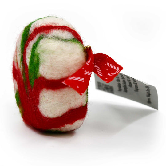 Red, green, and white felted soap with a red bow on a white background