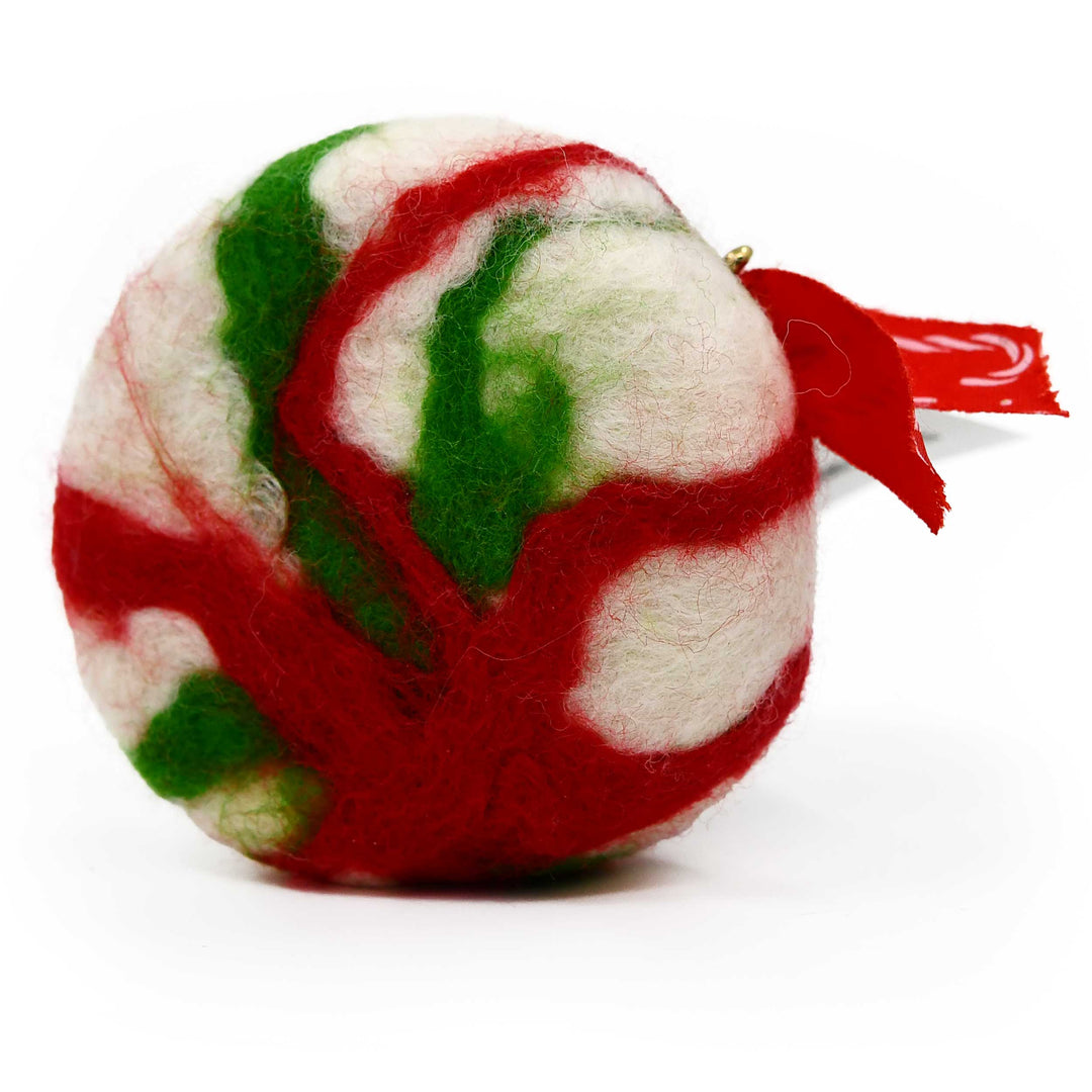 Felted soap with red and green patterns on a white background