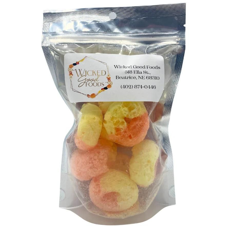 A bag of freeze dried peach rings on a white background