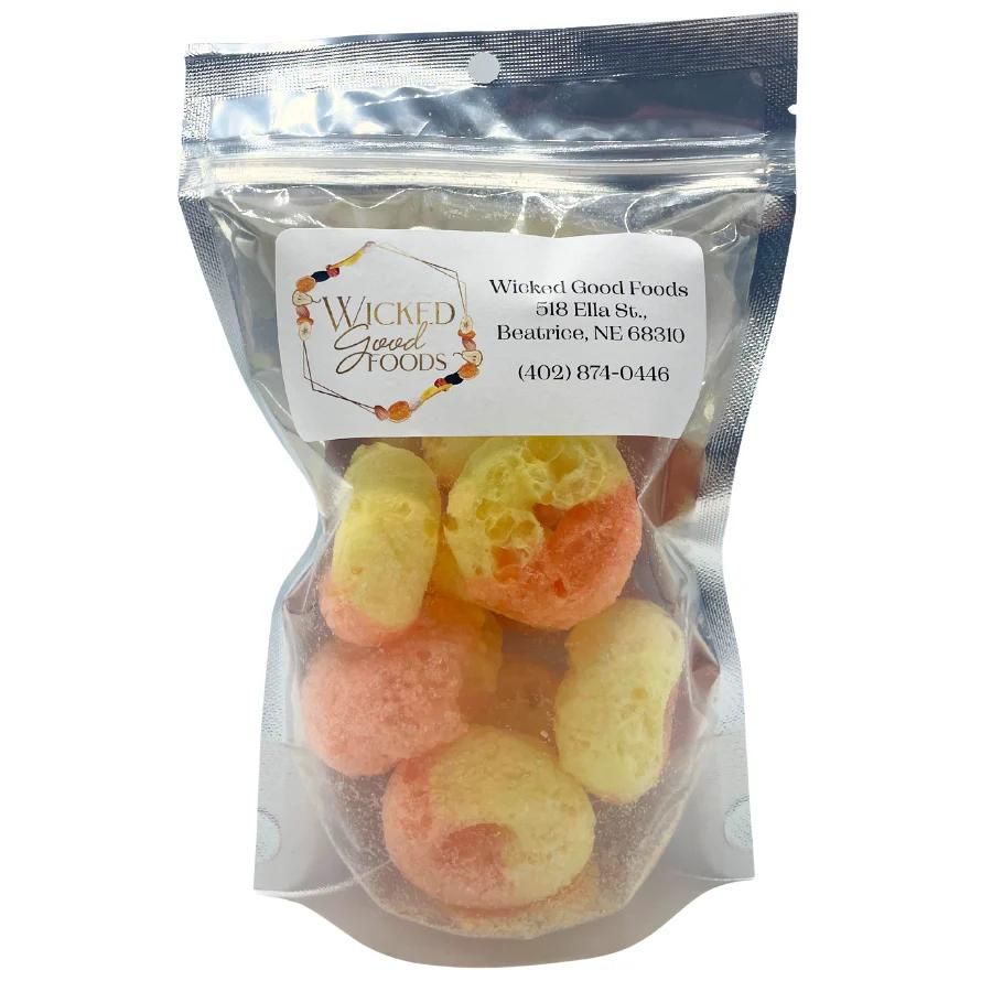 A bag of Peach Rings on a white background