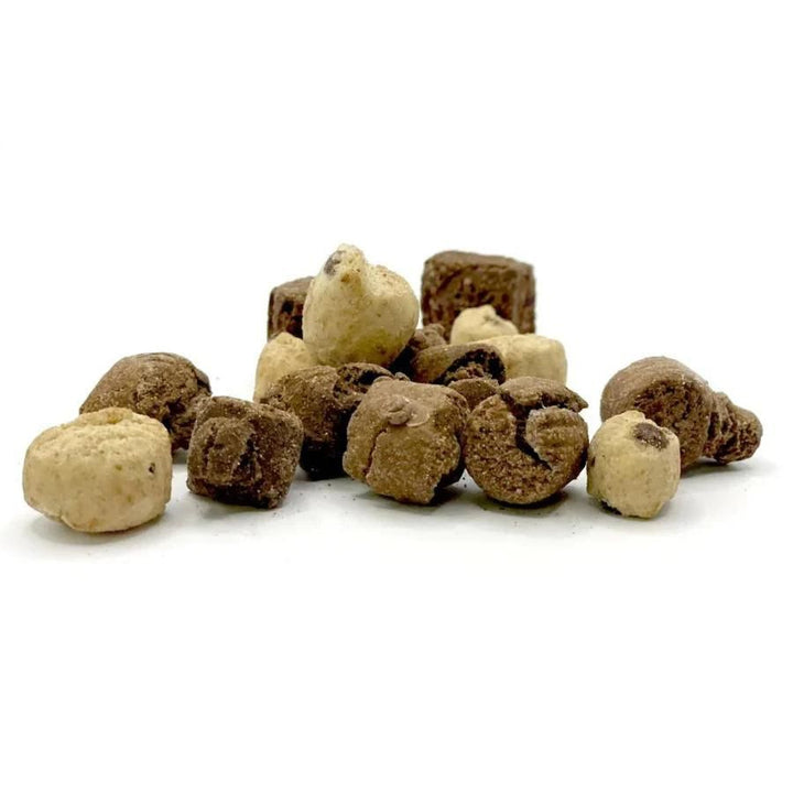 A pile of freeze dried cookie dough bites on a white background