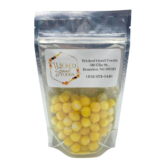 A bag of freeze dried Lemon Head Bites on a White Background