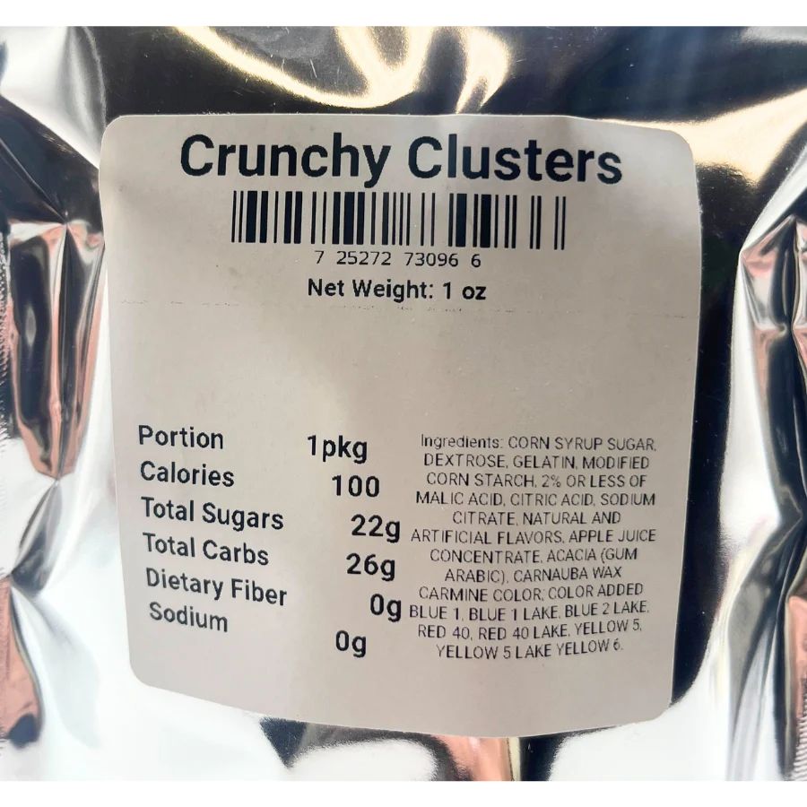 The ingredient/nutrition fact list for Crunchy Clusters: Portion 1 pkg, Calories 100, Total Sugars 22g, Total Carbs 26g, Dietary Fiber 0g, Sodium 0g