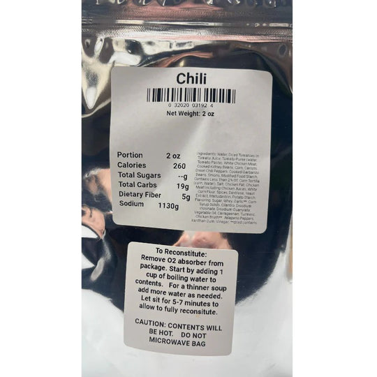 A close up of the ingredients/nutrition facts of Chili: Portion 2 oz, Calories 260, Total Sugars --g, Total Carbs 19g, Dietary Fiber 5g, Sodium 1130g