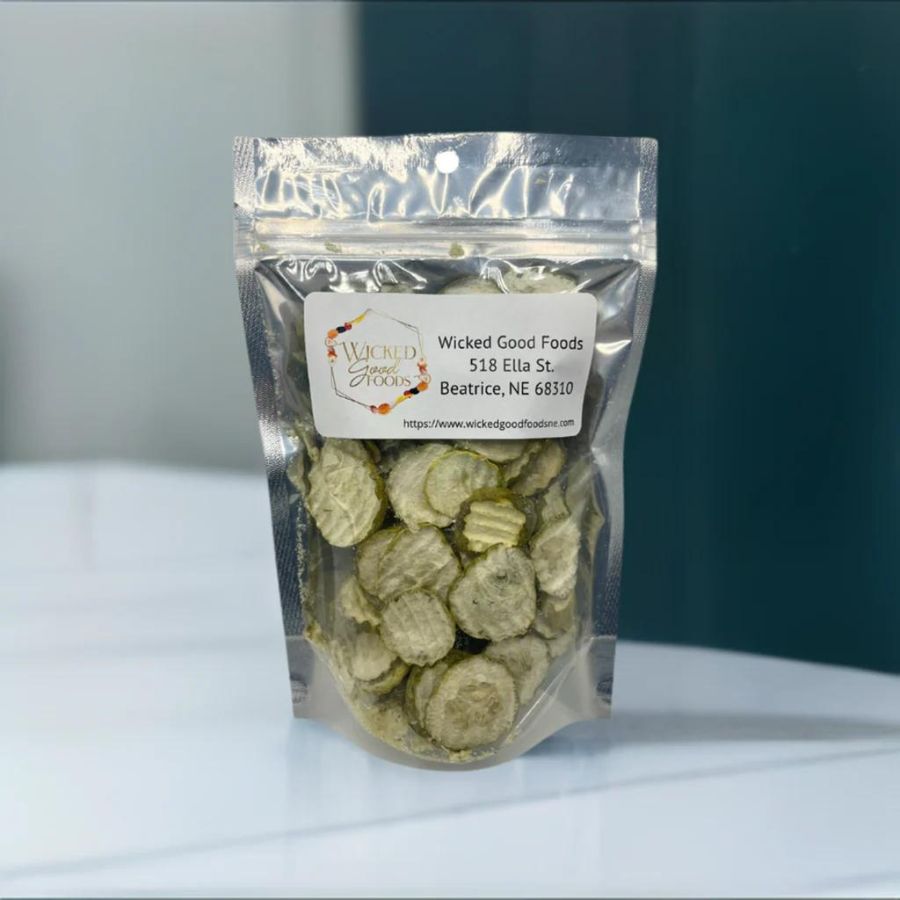 A bag of freeze dried pickles on a white countertop