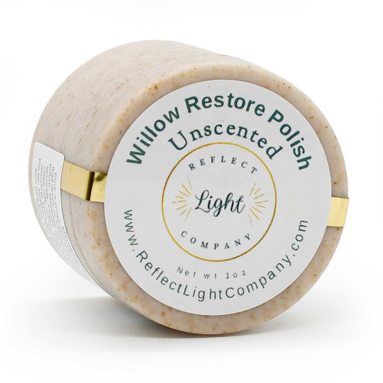 A 1 oz round plastic jar of Reflect Light Company Willow Restore Polish Unscented, showing the textured beige polish inside and a white label with gold and green text, on a white background.