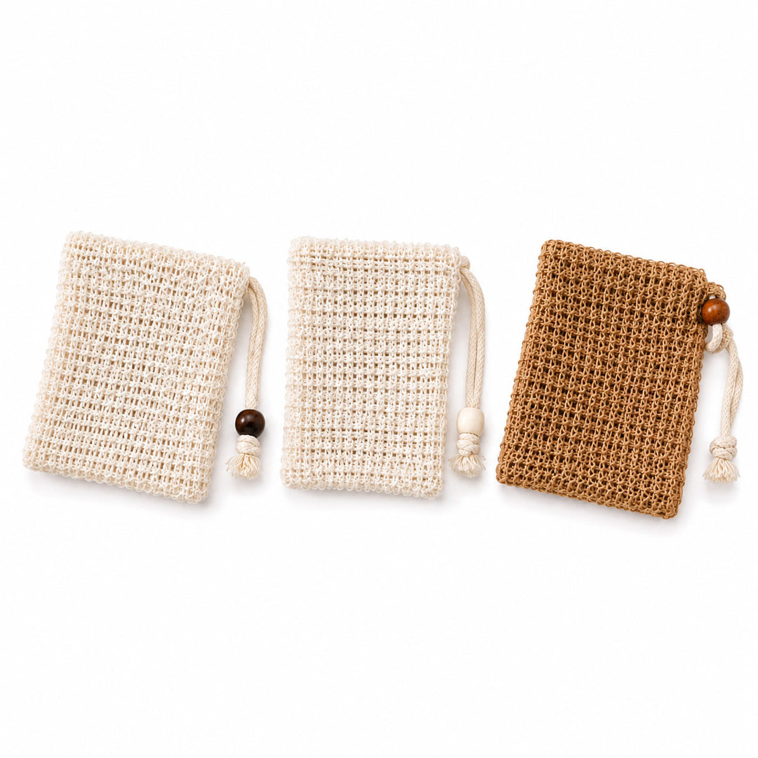 Three small woven drawstring pouches arranged side by side on a white background, with two in warm off-white/cream and one in medium brown. Each pouch has a knitted body, a cord tie, and a small wooden bead accent.