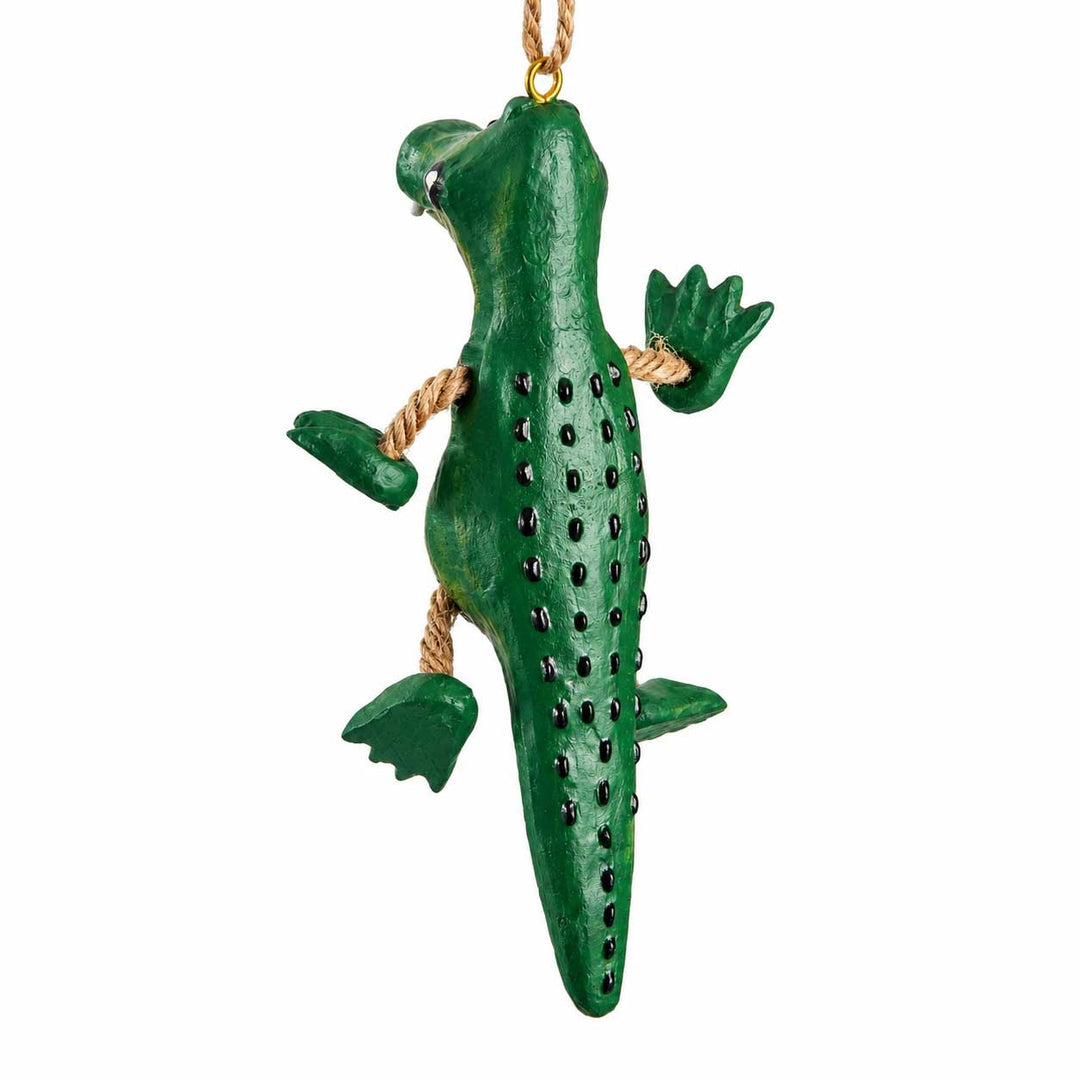 A green alligator ornament hanging from a tan rope loop, shown against a plain white background.