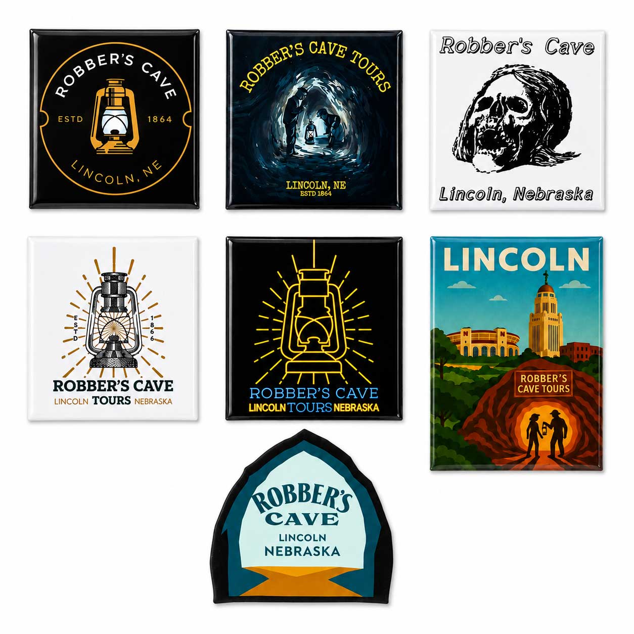 A set of seven square and rounded-rectangle souvenir magnets or tiles featuring Robber's Cave tours and Lincoln, Nebraska imagery, arranged on a plain white background.