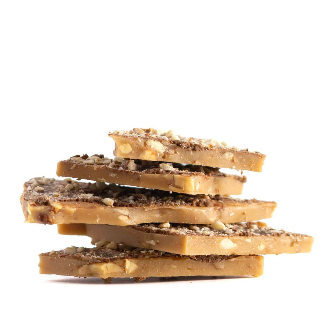 Stack of toffee candy pieces on a white background