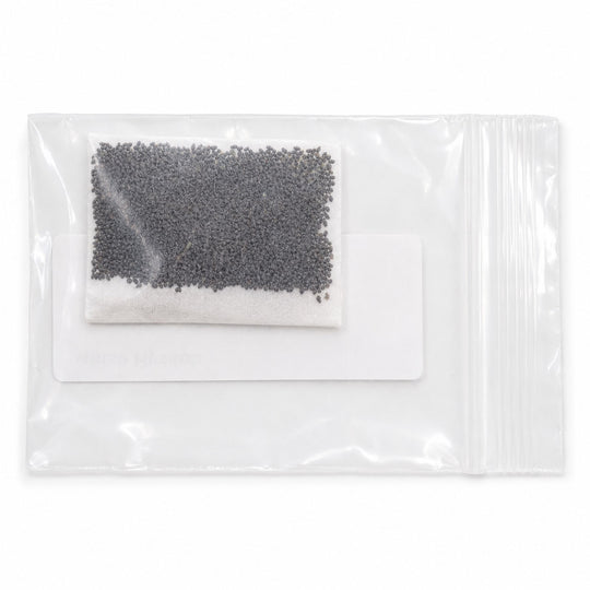 Clear plastic package with black beads and a white cloth inside on a white background