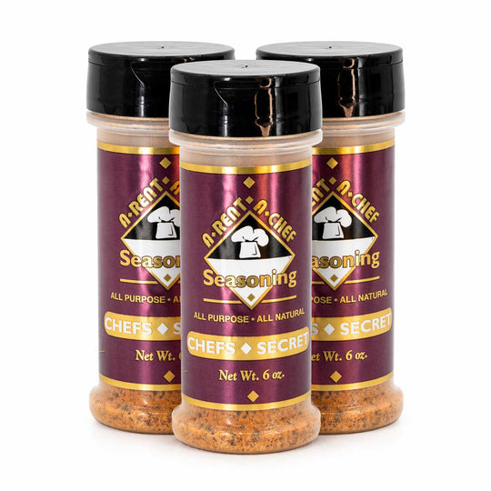 Three bottles of A-Rent-A-Chef seasoning on a white background