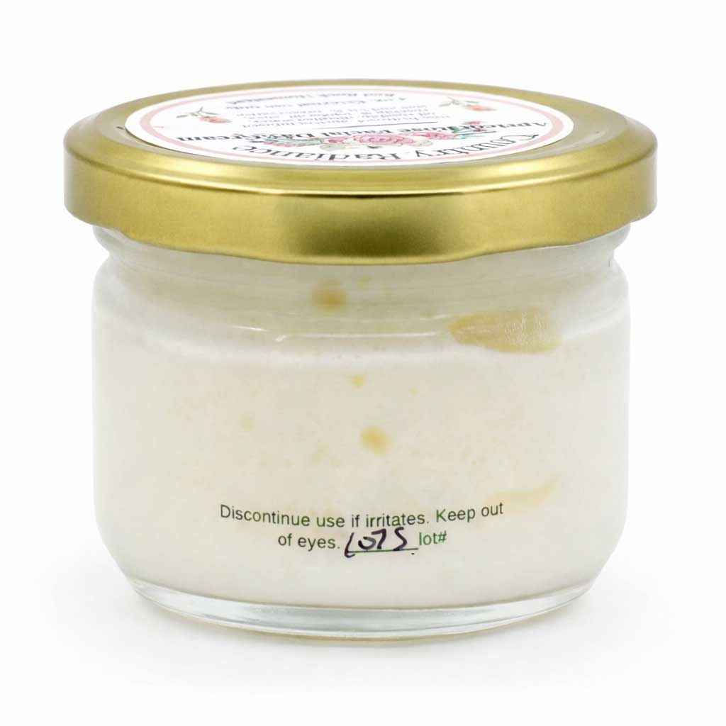 Glass jar with gold lid on a white background
