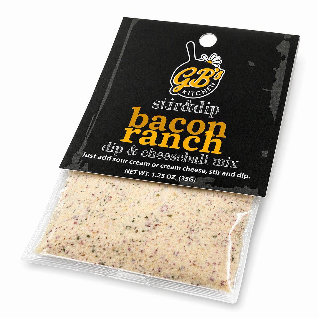 Packaged bacon ranch dip & cheeseball mix with black label on a white background