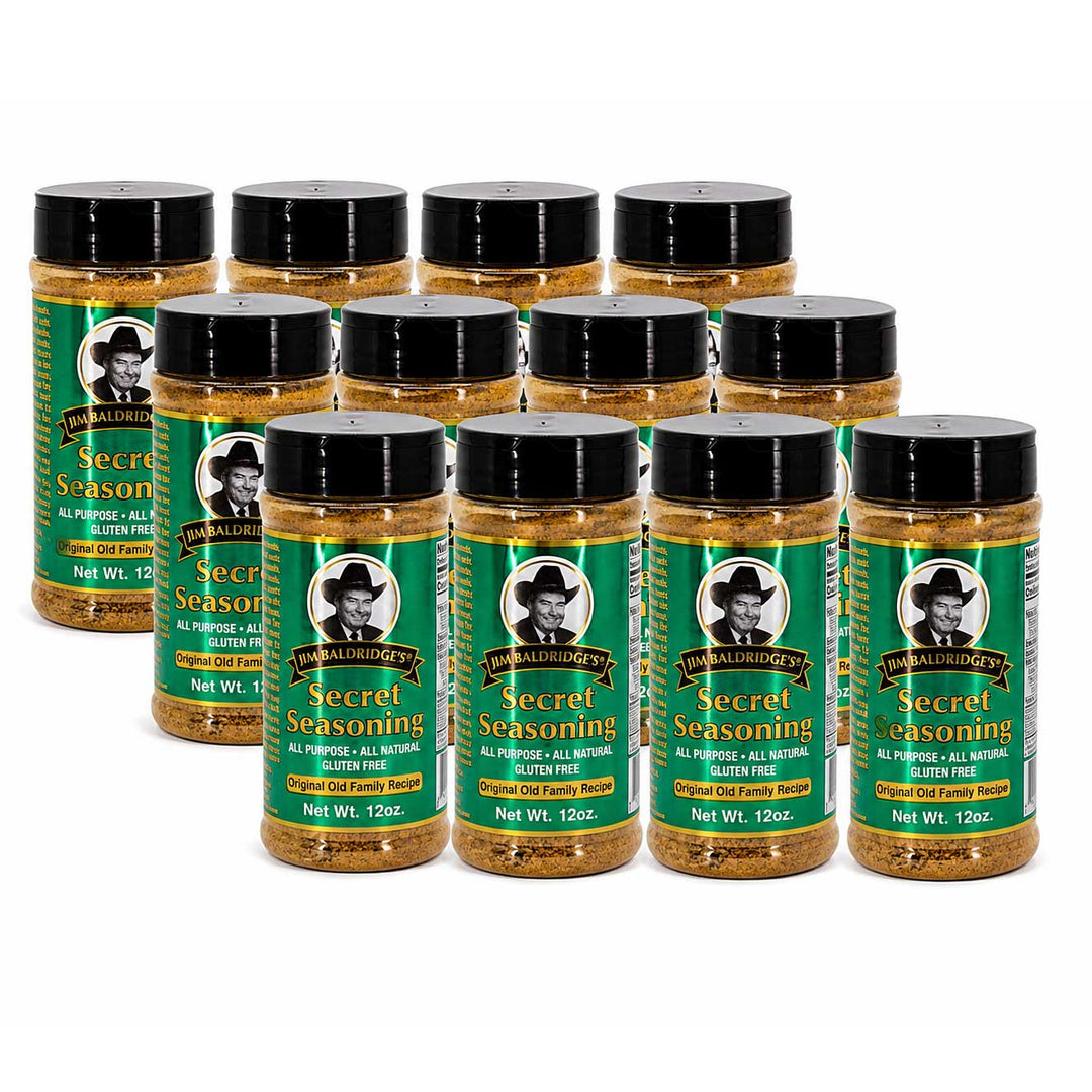 Twelve bottles of The Secret Ingredient Company's Secret Seasoning arranged in three rows on a plain white background.