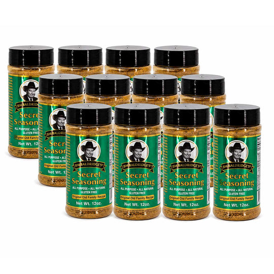 Twelve bottles of The Secret Ingredient Company's Secret Seasoning arranged in three rows on a plain white background.