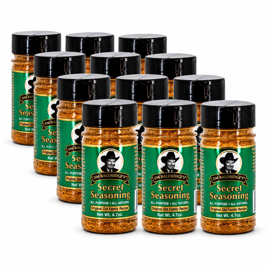 A 12-pack of Jim Bailes' Secret Seasoning in clear plastic jars with black lids and green labels, arranged in two rows on a white background.