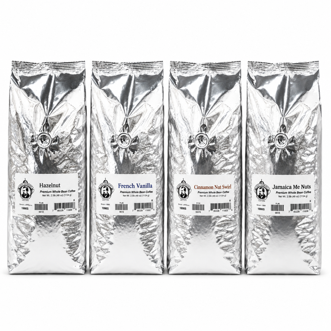 Four silver coffee bags with different flavors on a white background