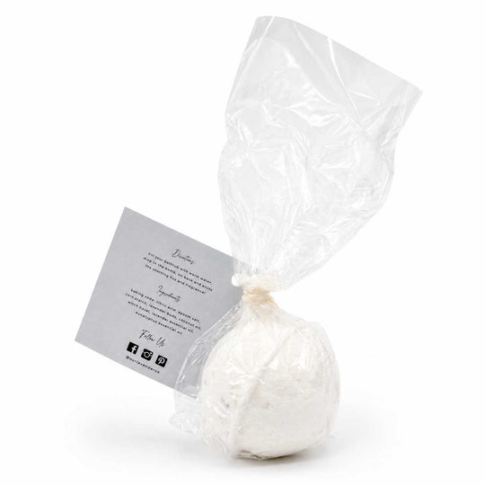 White bath bomb in clear plastic packaging with a label on a white background