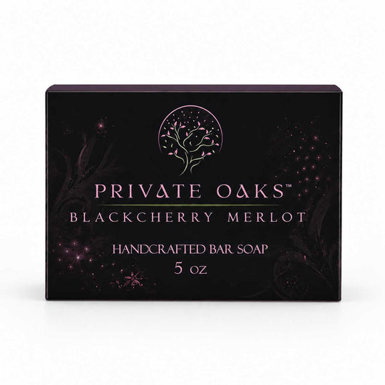 A rectangular black bar soap box for Private Oaks Blackberry Merlot, featuring a pink tree logo and text, set against a plain white background.