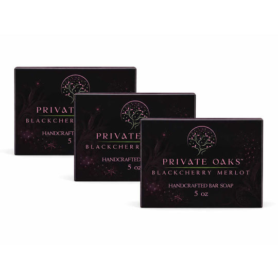 Three rectangular boxes of Private Oaks Blackberry Merlot Handcrafted Bar Soap arranged in a staggered row on a plain white background.