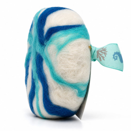 Felted swirled product with blue and white design on a white background