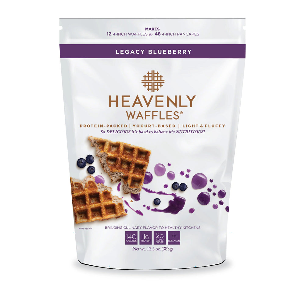 A package of Heavenly Waffles Legacy Blueberry mix showing the waffle mix bag with an image of blueberries and cooked waffles on the front.