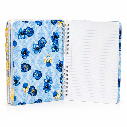 An open spiral-bound notebook with a light blue floral cover and lined white pages, photographed on a clean white background.