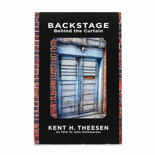 Book cover of 'Backstage Behind the Curtain' by Kent H. Theesen with a door and brick wall design.