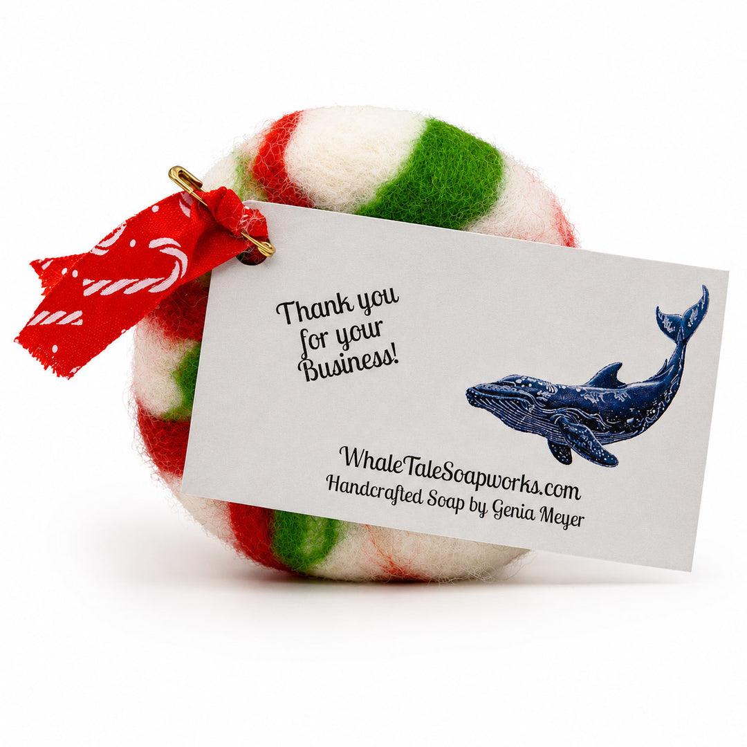 Colorful striped bath bomb with a 'Thank you for your business!' tag and whale illustration on a white background