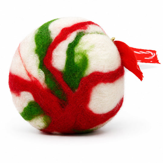 Decorative ball with red, green, and white pattern on a white background