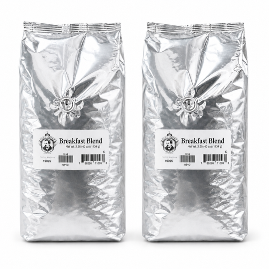 Two packages of 'Breakfast Blend' coffee on a white background